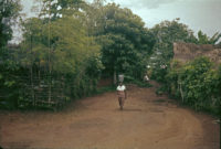 Obiekwe's wife carrying water in Umu-Anyo, 1961