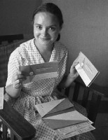 Helen brandishing airline tickets to Rome, June 1962